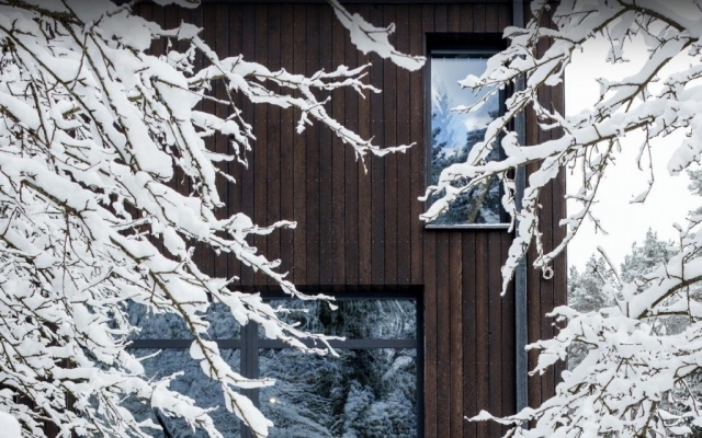 PermaChar - scorched larch cladding building in the snow