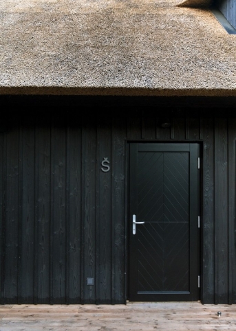 Thatched cottage with charred timber cladding